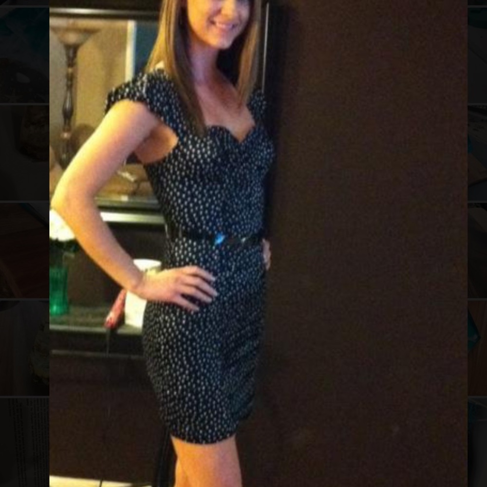 Form fitting cocktail dress.   Belt included